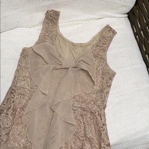 Lace tank beige with cute bow on back.